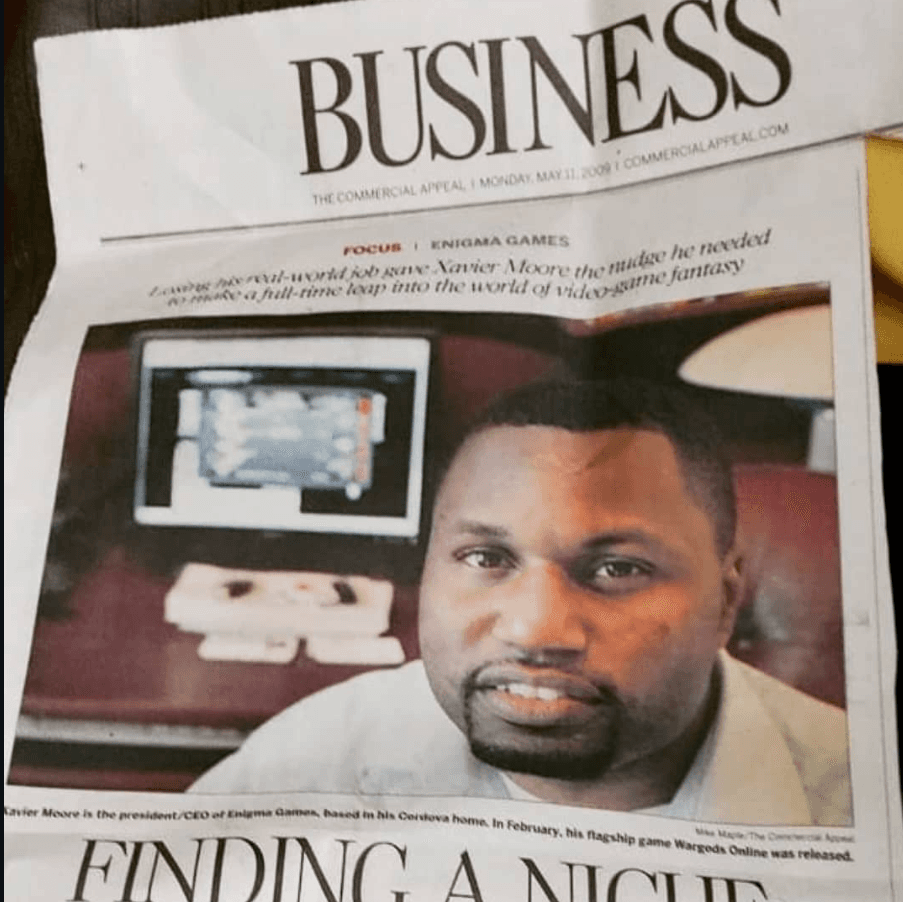 Newspaper clipping from The Commercial Appeal business section featuring Xavier Moore of Enigma Games under the headline Finding a Niche
